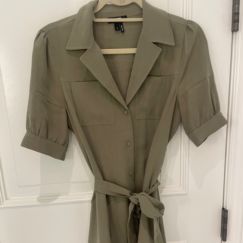 Women’s mid length kacky green dress with ruffle and detachable belt.